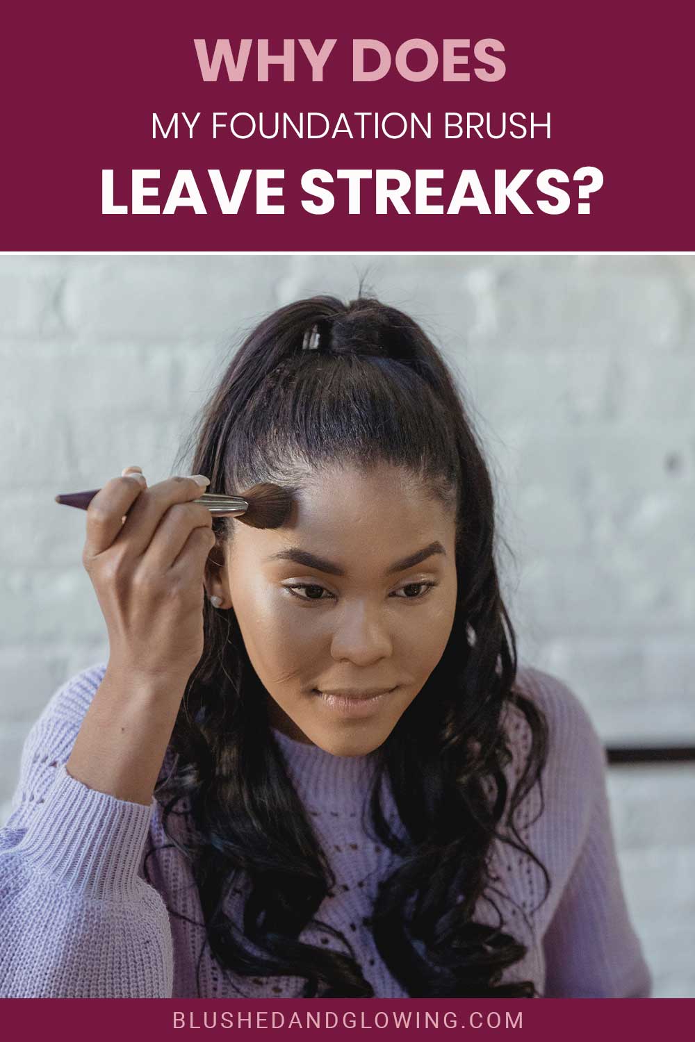 Woman in purple sweater applying foundation with a brush - Why Do Foundation Brushes Leave Streaks?